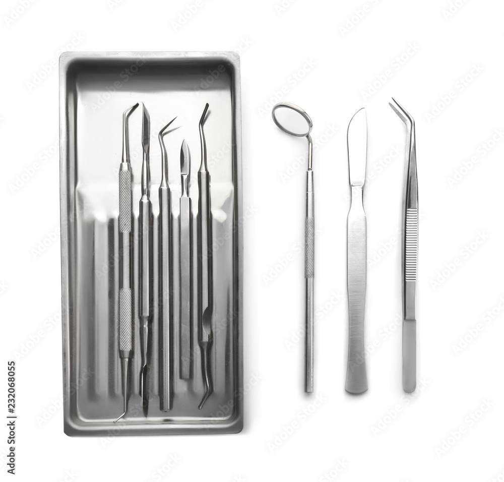 Dentist's tools on white background