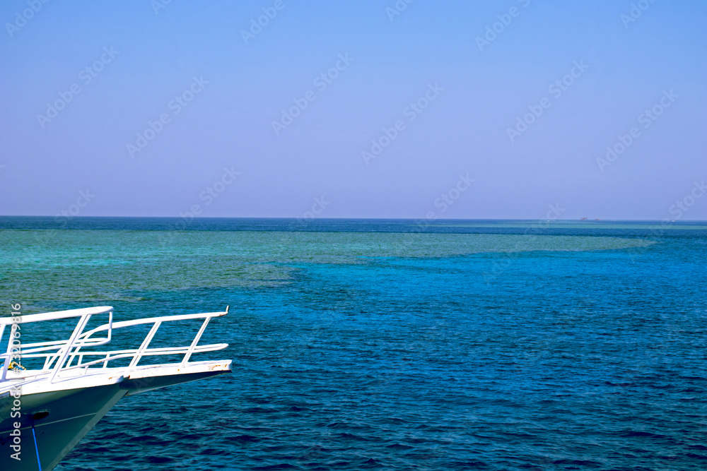 Beautiful view at azure Red Sea with a white yacht