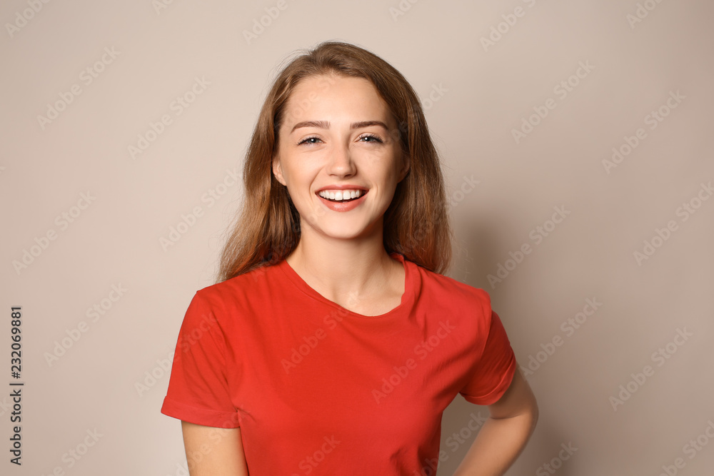 Portrait of happy young woman on light background Portrait of happy young woman on light background