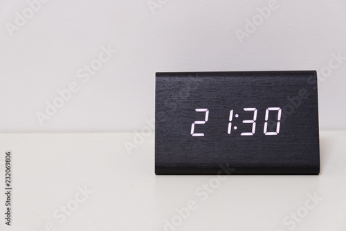 Black Digital Clock On A White Background Showing Time 21 30 Stock Photo Adobe Stock