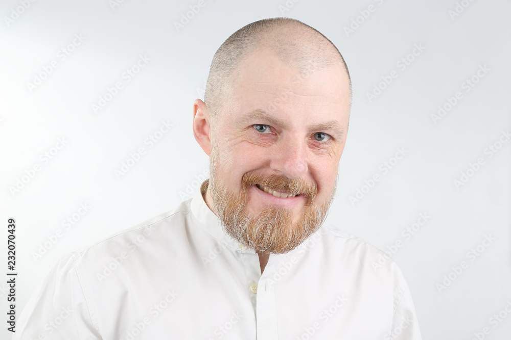portrait of a bearded man on a light background portrait of a bearded man on a light background