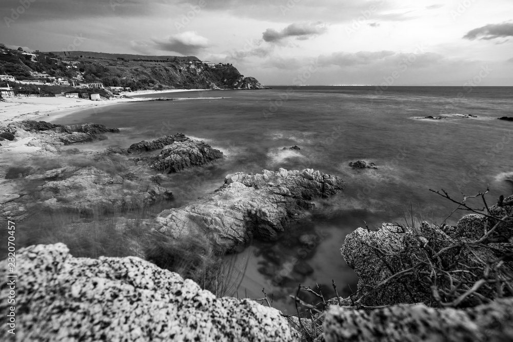 Bay of Grotticelle at dusk, black and white landscape, Capo Vaticano, Calabria, Italy