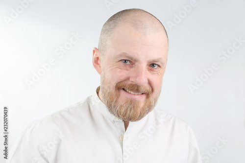 portrait of a bearded man on a light background © photosaint