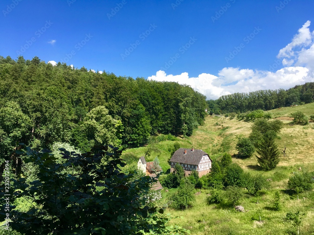 traditional german half-timbered house in peaceful landscape