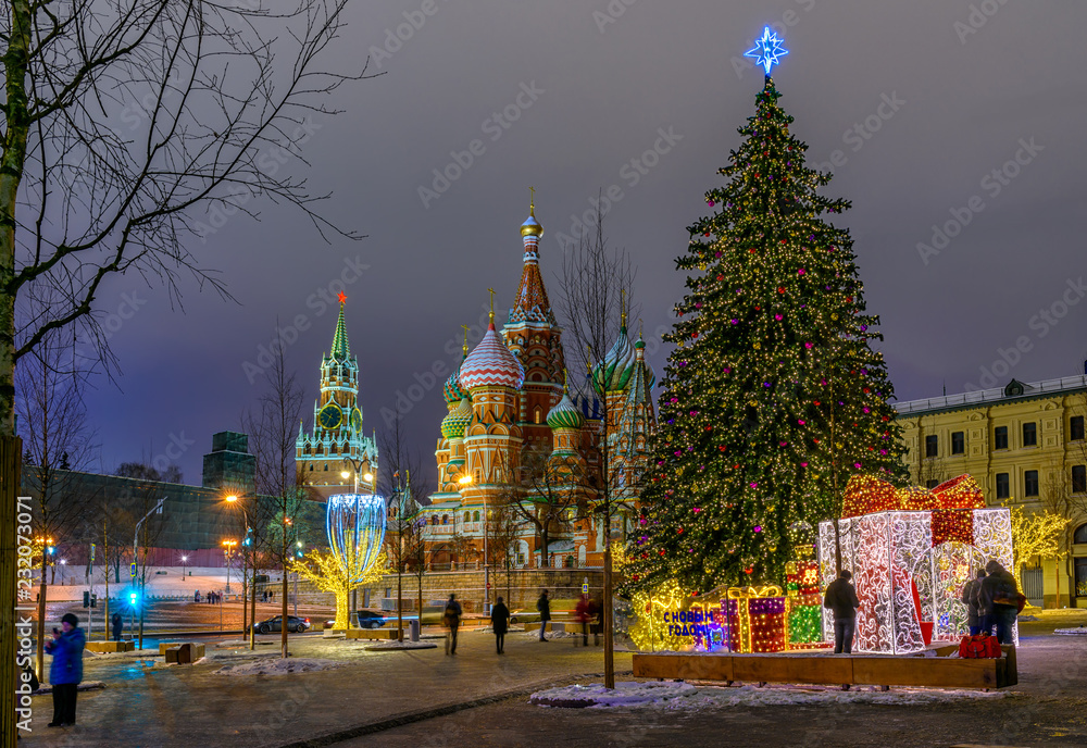Night view of Spasskaya Tower, Moscow Kremlin and Saint Basil s Cathedral in Moscow, Russia. Architecture and landmarks of Moscow. Moscow with Christmas decoration.