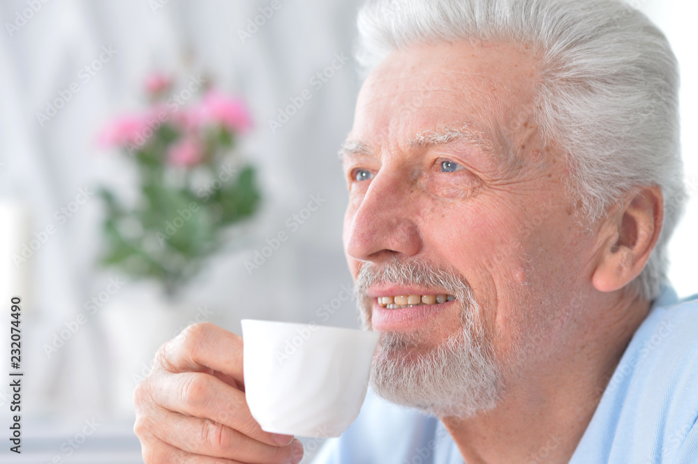 Portrait of happy senior man drinking tea Portrait of happy senior man drinking tea