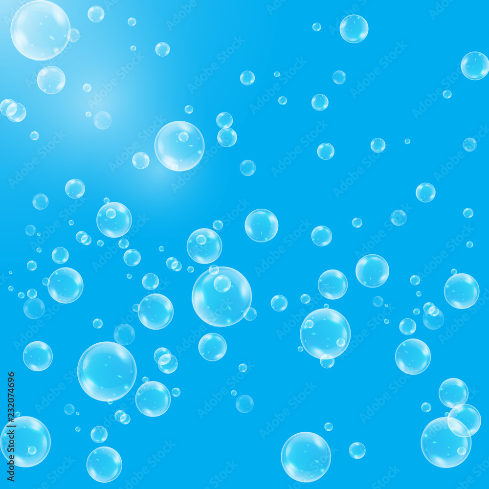 Realistic soap bubbles with rainbow reflection set isolated on the blue background.