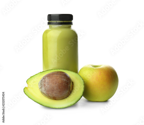 Bottle of fresh smoothie with avocado and apple on white background