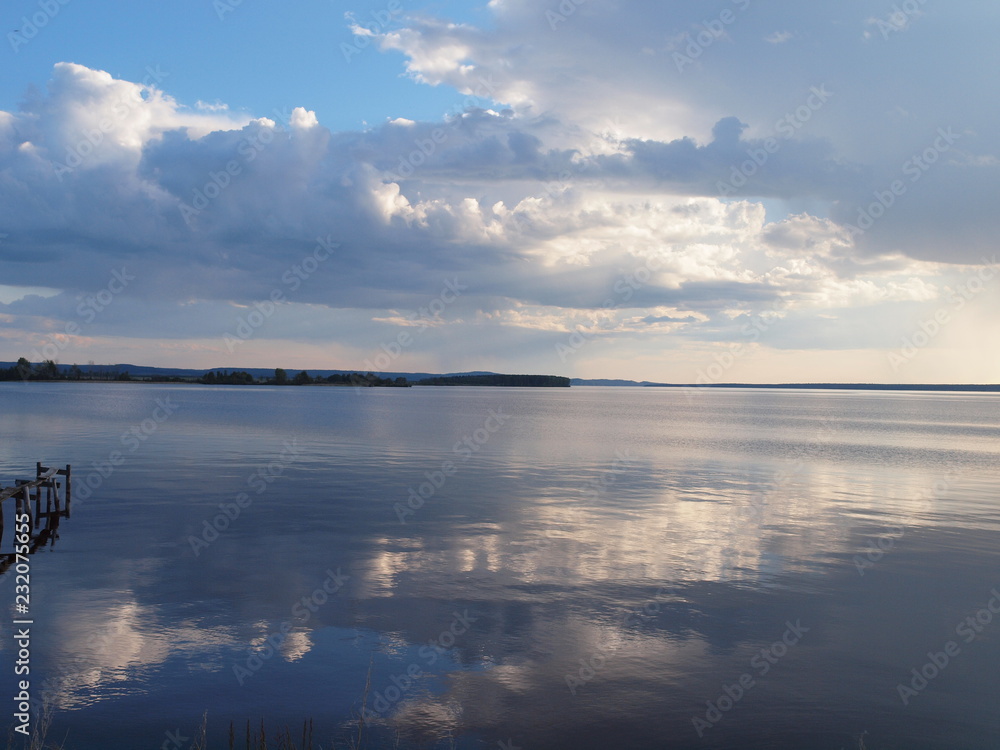 Fototapeta premium Clouds over the river. Russian summer nature. Russia, Ural, Perm region