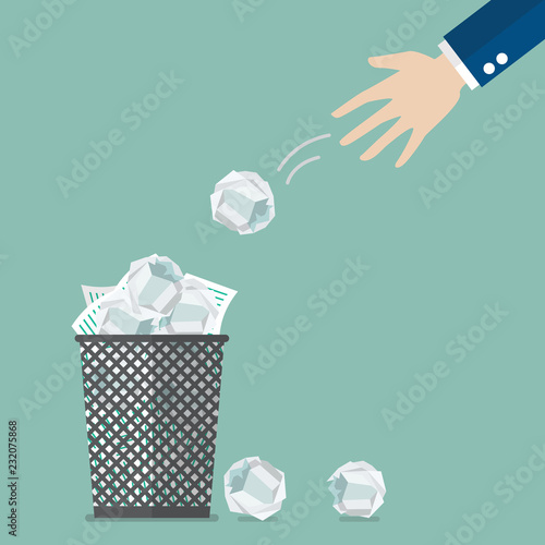 Businessman throwing crumpled paper to trash
