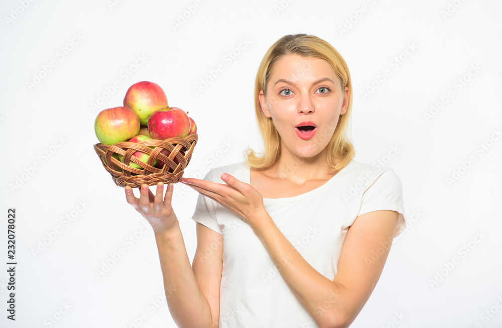 Metabolism and dieting. Healthy nutrition concept. Woman know how stay in shape and be healthy. Take advantage of this fall produce and bite into juicy apple. Girl hold basket apples white background Metabolism and dieting. Healthy nutrition concept. Woman know how stay in shape and be healthy. Take advantage of this fall produce and bite into juicy apple. Girl hold basket apples white background