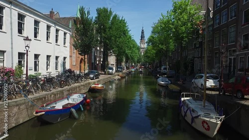 ‘Groenburgwal’ Canal behind the famous ‘Staalmeestersbrug’ in Amsterdam where lovers secured a lock on the bridge photo