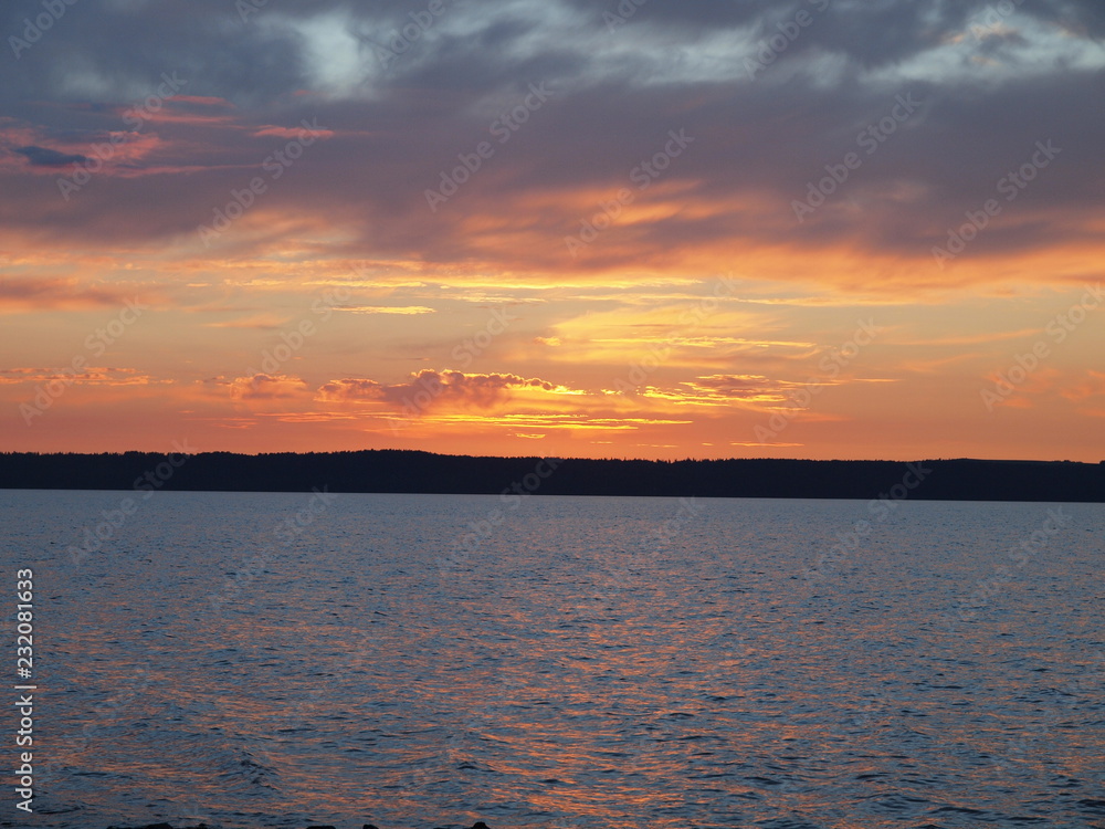 Sunset. On the big river. Summer. Russia, Ural, Perm region Sunset. On the big river. Summer. Russia, Ural, Perm region