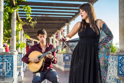 Band performing traditional music fado under pergola with azulejos in Lisbon, Portugal photo