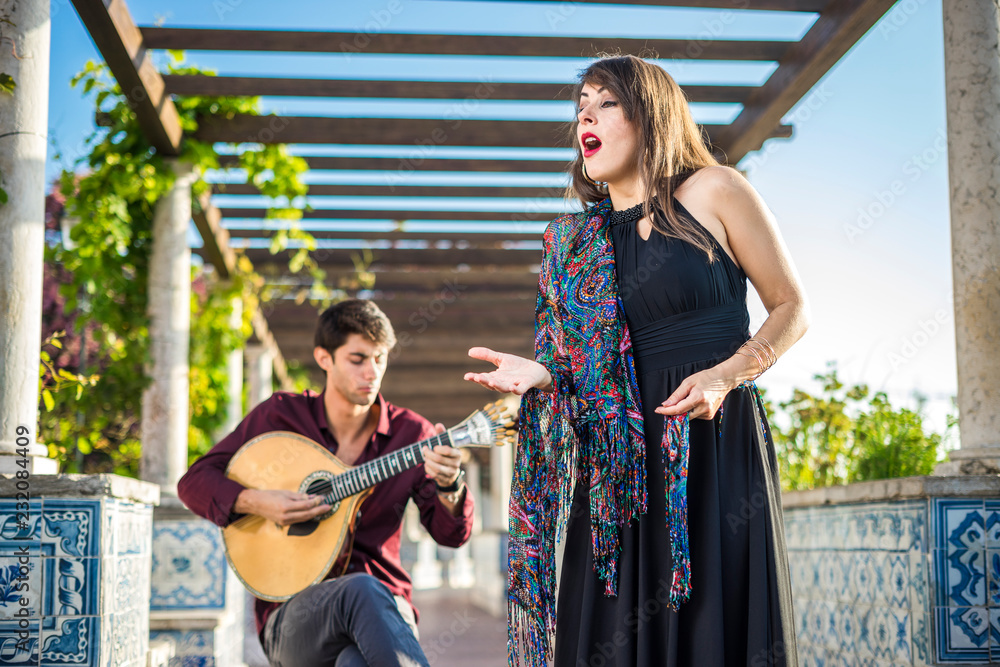 Band performing traditional music fado under pergola with azulejos in Lisbon, Portugal