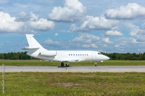 Airplane taxiing on the apron of the airport on the asphalt for take off.