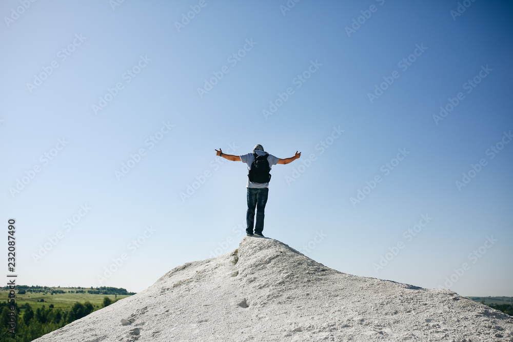 Freedom concept. Man is standing in rocks. Freedom concept. Man is standing in rocks.