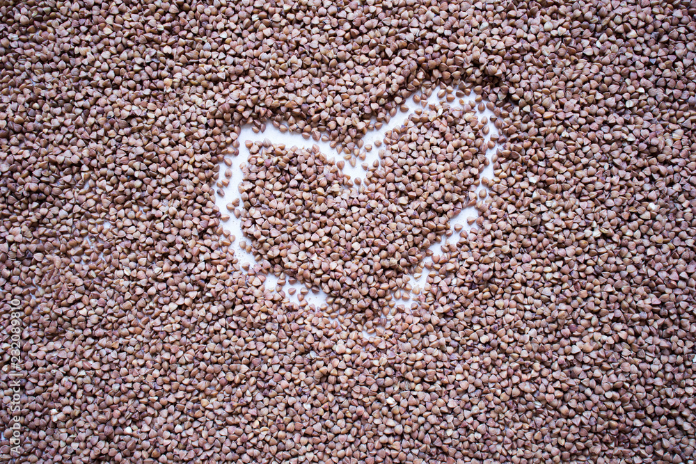 heart on the background of buckwheat seeds heart on the background of buckwheat seeds