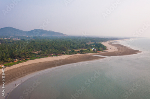 Sand beach on Arabian sea coastline in Murudeshwar Karnataka India