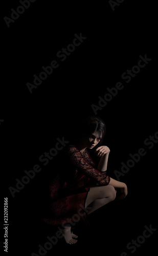 dancer with red dress and little light in studio