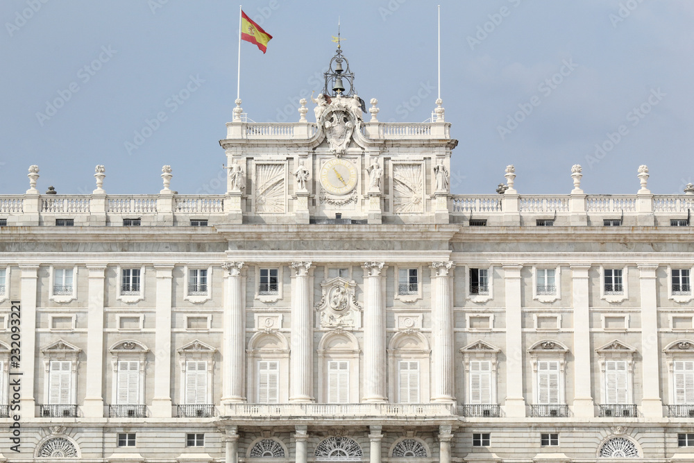 The neoclassical Royal Palace (Palacio Real) of Madrid entrance as seen from the Armory Square (Plaza de la Armeria), in a sunny summer day, Spain