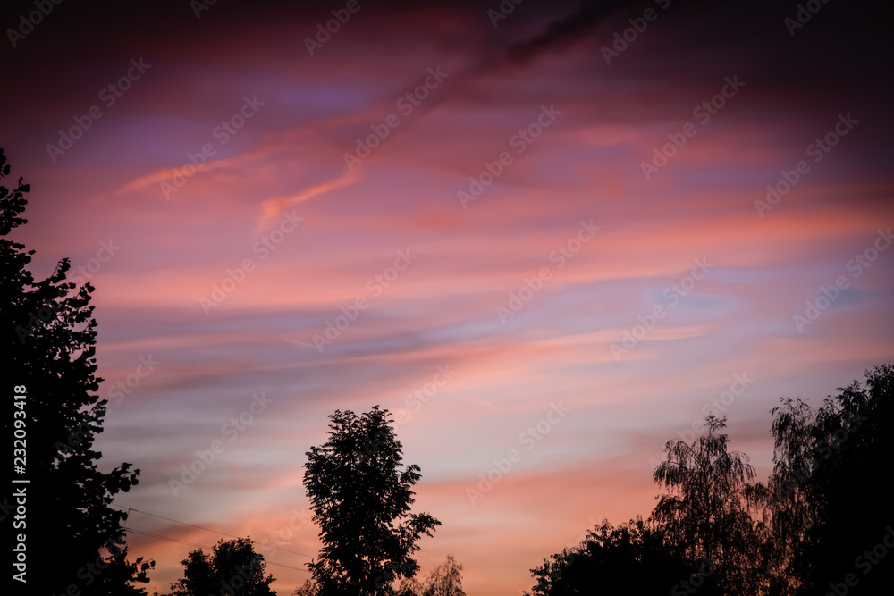 Fototapeta premium Dawn. Cloud in the sky at the back of the sun.