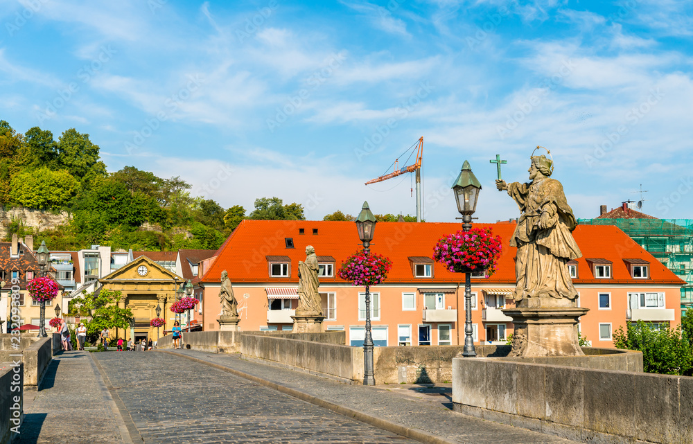 Alte Mainbrucke, the old bridge across the Main river in Wurzburg, Germany Alte Mainbrucke, the old bridge across the Main river in Wurzburg, Germany