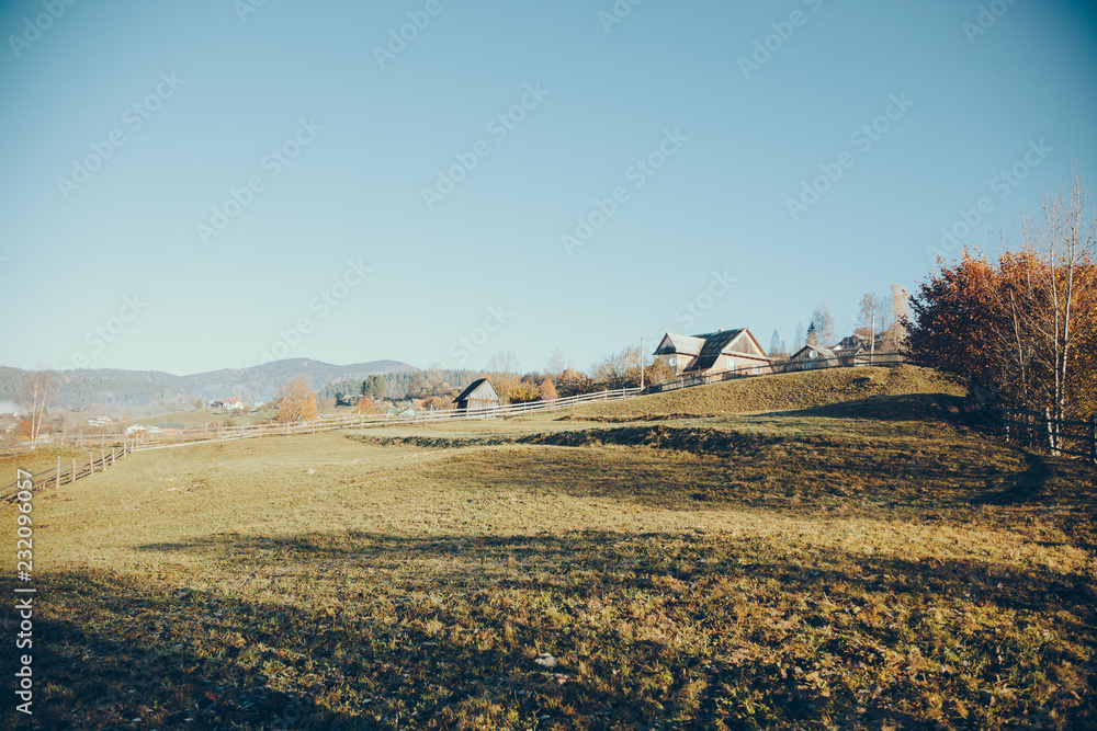 Obraz premium pasture with buildings in mountain Vorokhta town, Carpathians, Ukraine