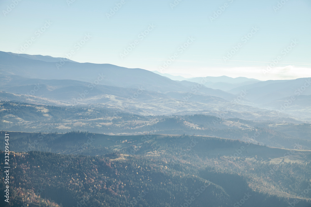 hazy mountains landscape under blue sky, Carpathians, Ukraine