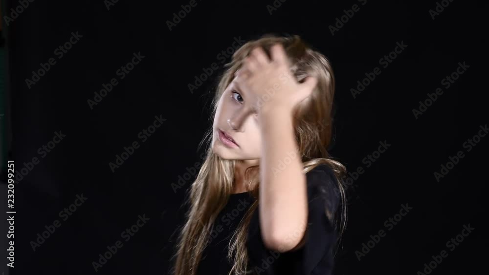 Kids and feelings, portrait of happy young caucasian girl smiling at camera. Girl on black posing. 4k Kids and feelings, portrait of happy young caucasian girl smiling at camera. Girl on black posing. 4k
