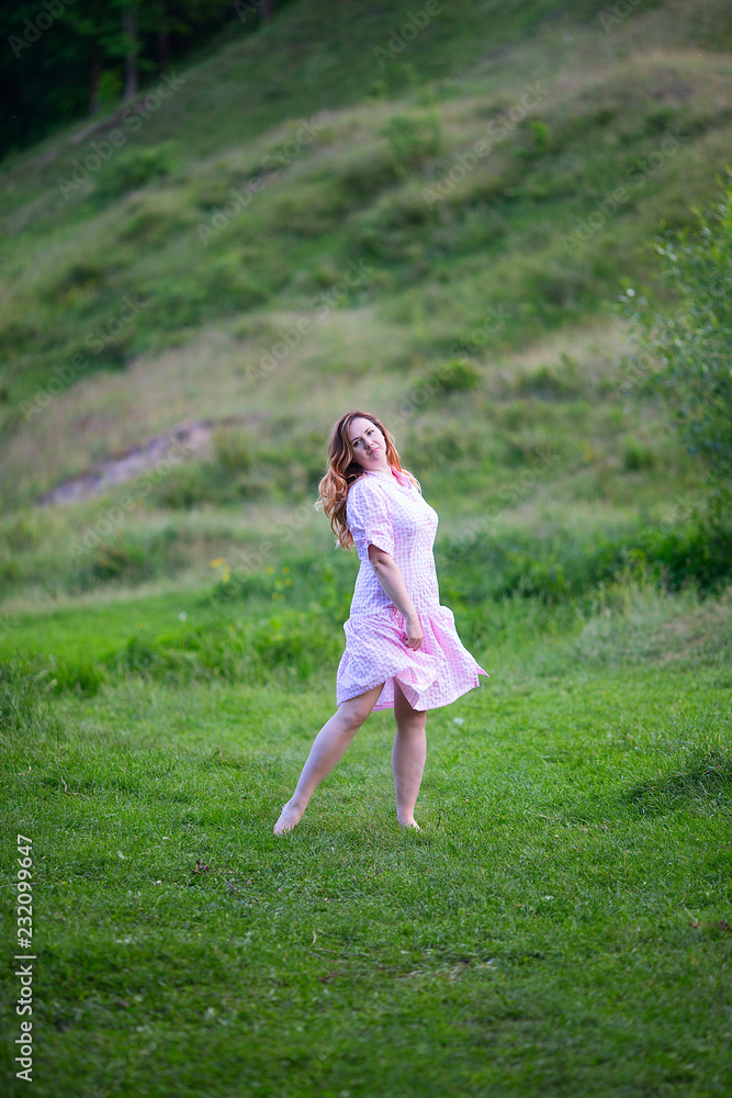 Beautiful girl in summer dress runs in the meadow. Beautiful girl in summer dress runs in the meadow.