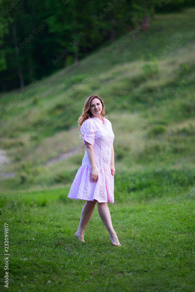 Beautiful girl in summer dress runs in the meadow. Beautiful girl in summer dress runs in the meadow.