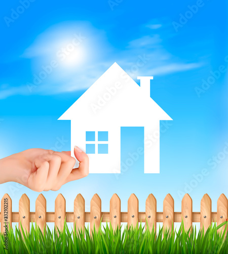 Creative Template Design for Real Estate. Hand holding a paper house. Vector illustration.