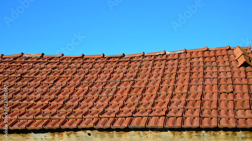 Roof with red tiles. Roof of Small country house.