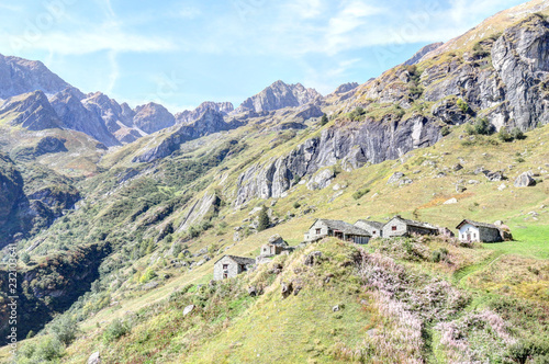 Wallpaper Mural The Walser town of San Giacomo Maggiore, with stone lodges, high mountains, forests and pastures, in summer, Val d'Otro valley, Alps mountains, Italy Torontodigital.ca