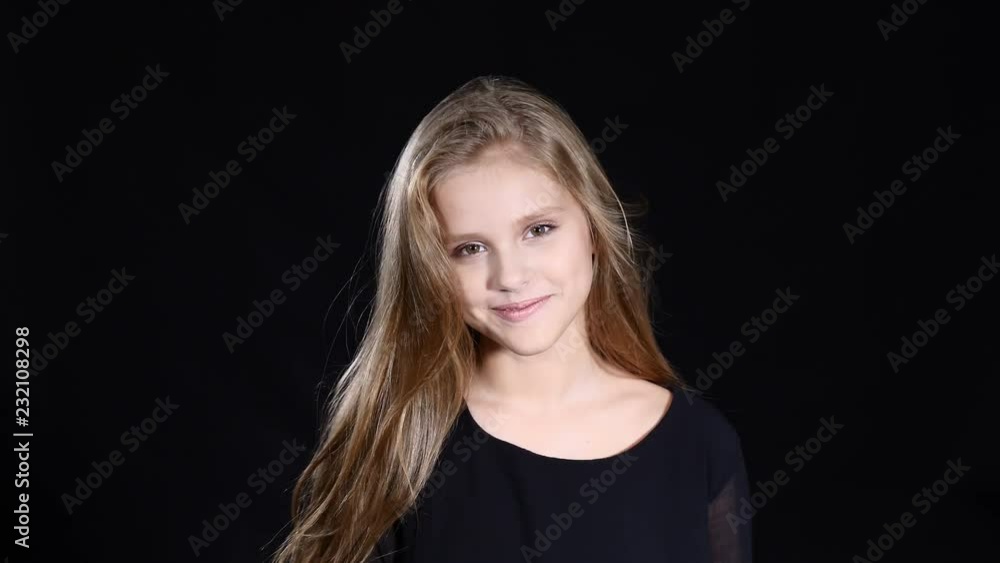 Videoportrait of adorable female teenager model with long blond hair posing looking at camera. Suitable for commercial. 4k Videoportrait of adorable female teenager model with long blond hair posing looking at camera. Suitable for commercial. 4k