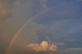 rainbow on the blue sky with sunset time