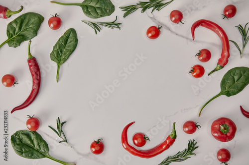 flat lay frame with fresh vegetables and herbs on white background
