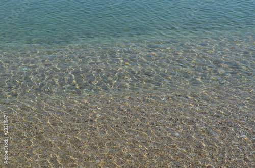 Sea rocks sand waves