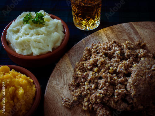 Haggis, with mashed potatoes, mashed swede and a wee dram of Scotch whiskey. Burns Night, Scotland