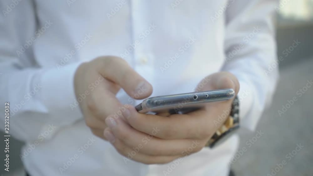 Extreme close up shot of male hands swiping on phone. Fingers touching screen in slow motion. Scrolling through news concept Extreme close up shot of male hands swiping on phone. Fingers touching screen in slow motion. Scrolling through news concept