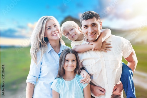 Happy cheerful family on background