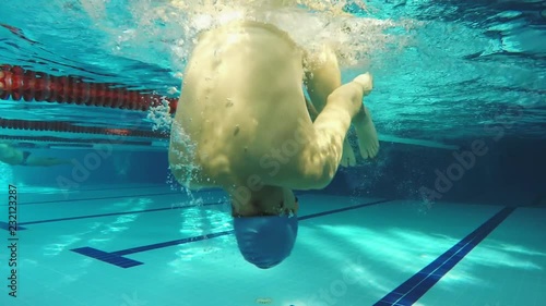 Underwater view swimmer swiming crawl stroke in the pool