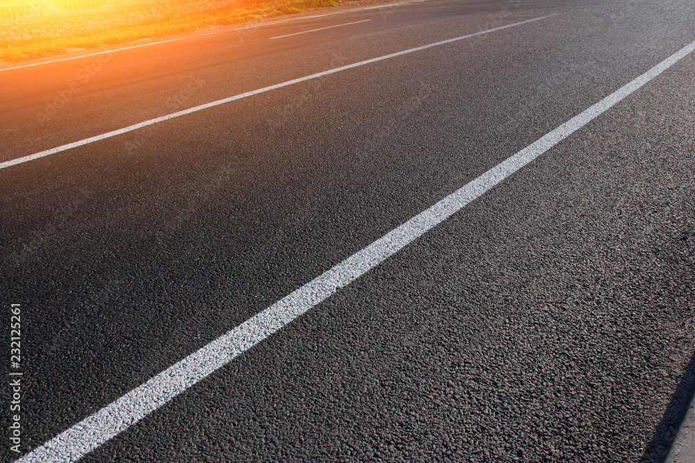 Asphalt road with marking lines white stripes