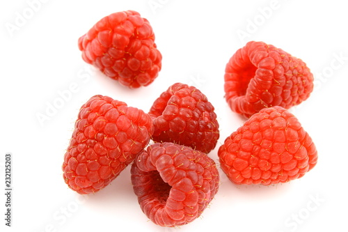 fresh red raspberry fruits isolated on a white background photo