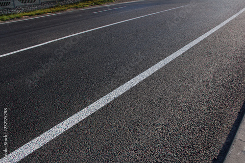 Obraz na płótnie Asphalt road with marking lines white stripes w salonie