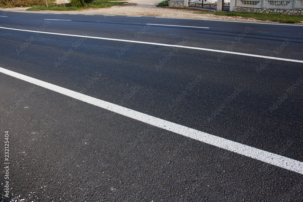 Asphalt road with marking lines white stripes Asphalt road with marking lines white stripes