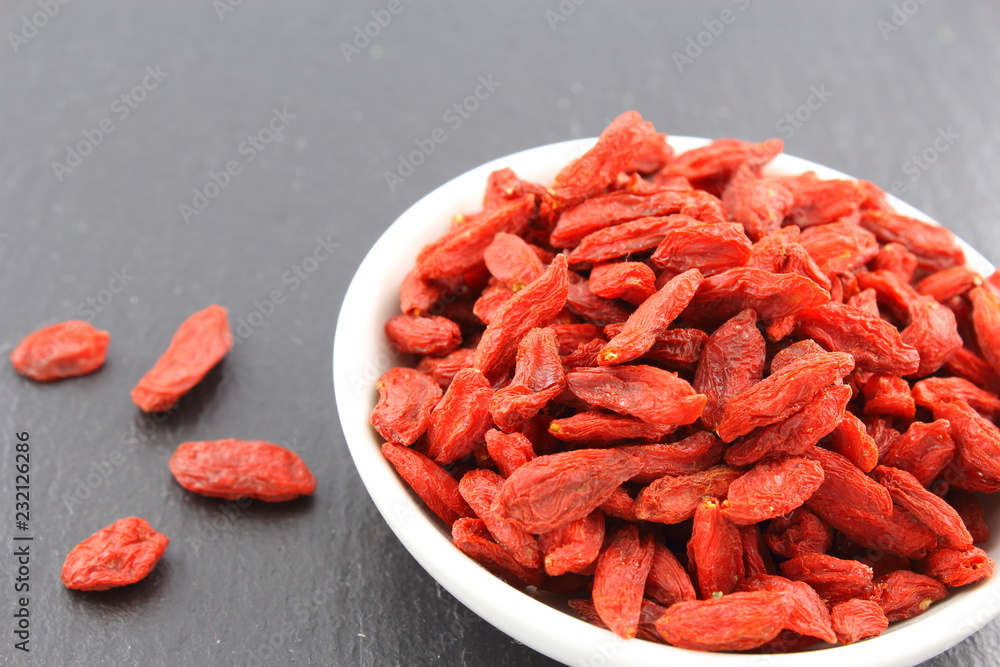dried goji berries in a small white bowl dried goji berries in a small white bowl