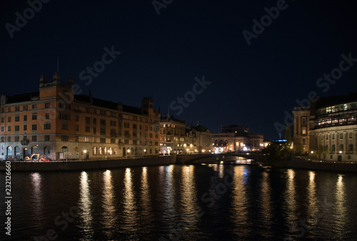 Evening view in Stockholm shilouettes of old town, parliament houses , bridges and lake Mälaren