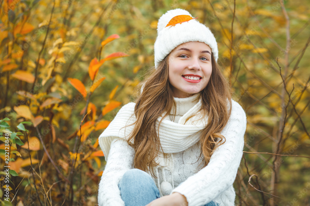 Young attractive woman in autumn colorful background Young attractive woman in autumn colorful background